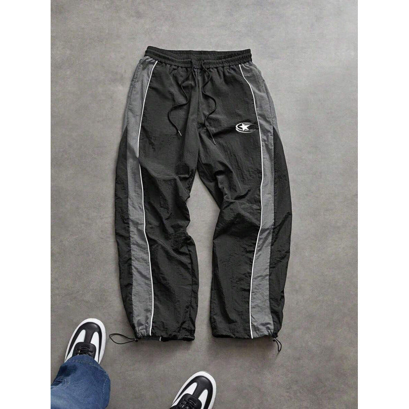 Men's spliced color-blocking printed casual pants with drawstring cuffs and loose straight-leg trousers